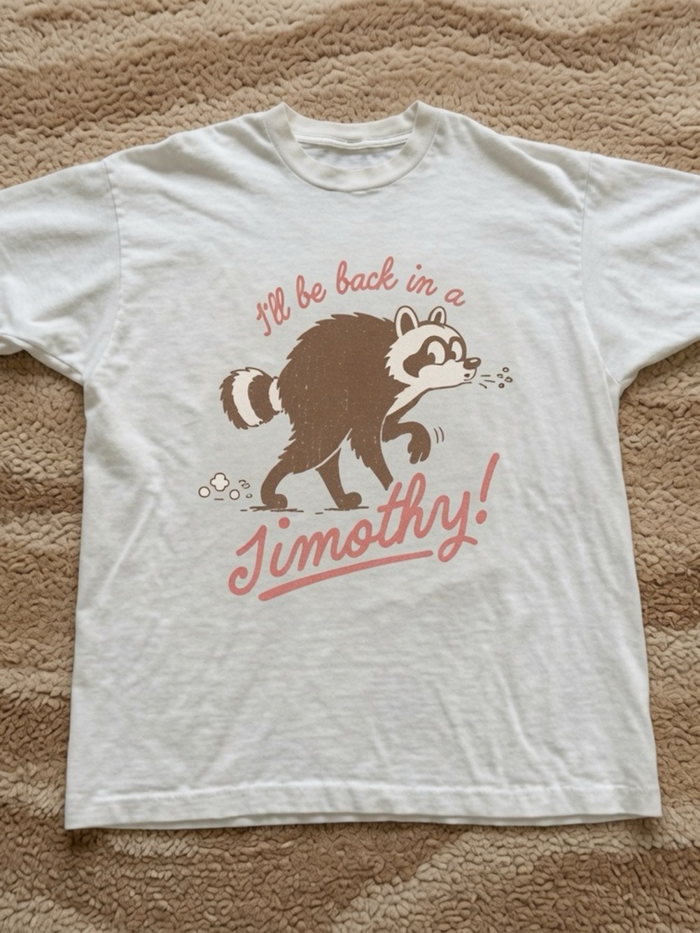 White T-Shirt with Brown Raccoon and Pink Script